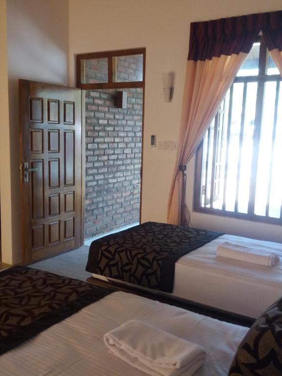 Postel nebo postele na pokoji v ubytování So-J Beach Villa