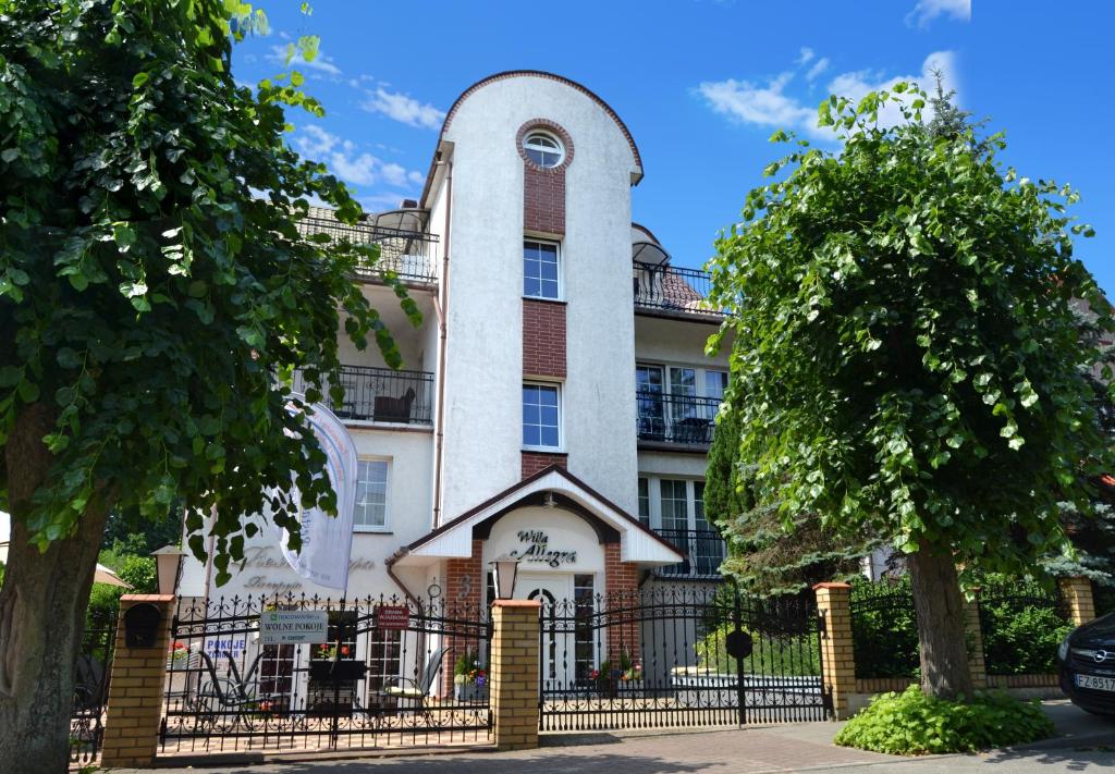 a building with a gate in front of it at Willa Allegra in Międzyzdroje