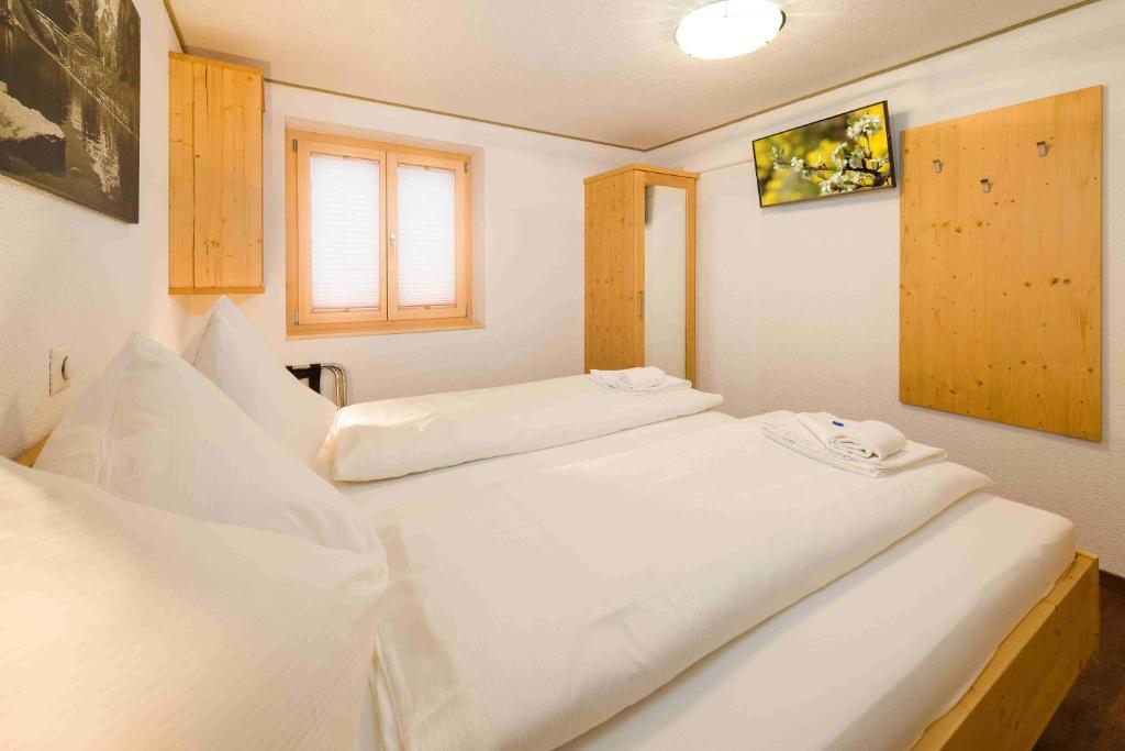 Postel nebo postele na pokoji v ubytování B&B AZapartments Lunic