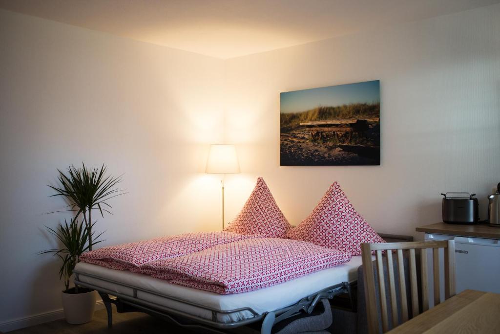 Postel nebo postele na pokoji v ubytování H24ZINGST - Das Ferienhaus