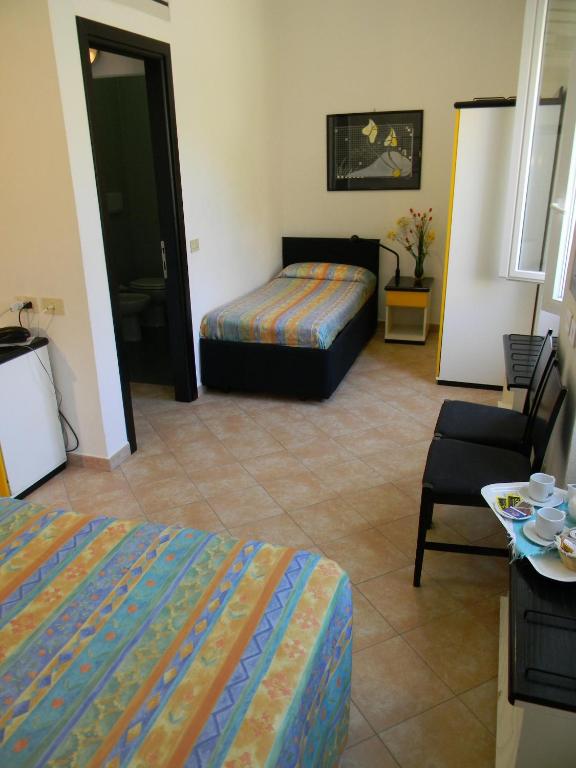 Postel nebo postele na pokoji v ubytování Hotel Nido D'aquila