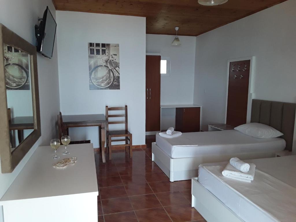 Postel nebo postele na pokoji v ubytování Hotel Riviera
