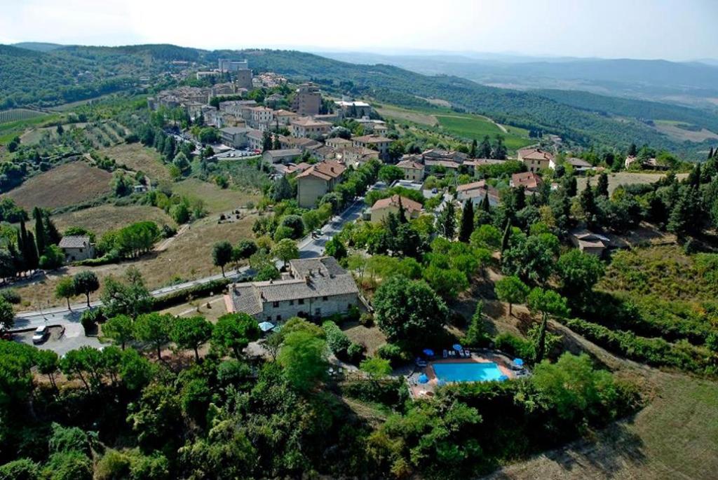 an aerial view of a village in the hills at Albergo Il Colombaio in Castellina in Chianti