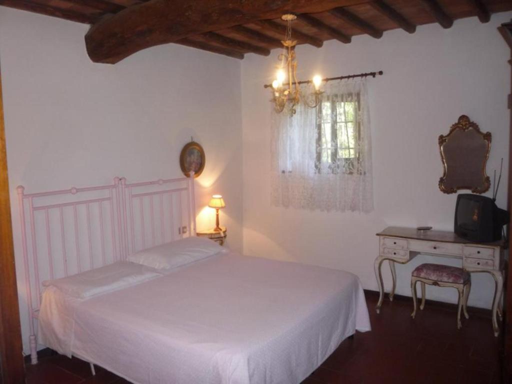 Postel nebo postele na pokoji v ubytování Albergo Il Colombaio