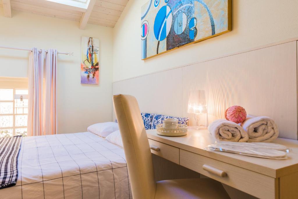 Postel nebo postele na pokoji v ubytování Relais Il Nido