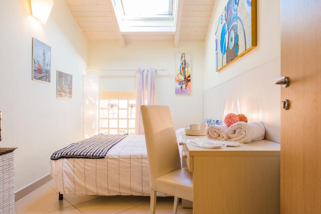 Postel nebo postele na pokoji v ubytování Relais Il Nido