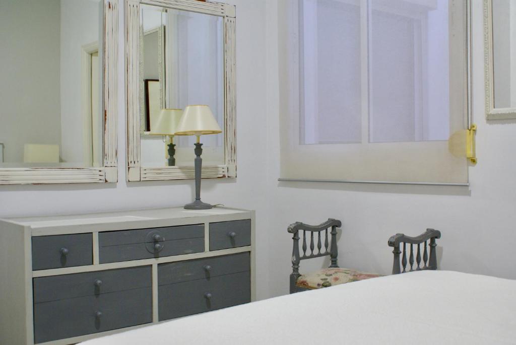 Łóżko lub łóżka w pokoju w obiekcie Apartamento Mar de Korus