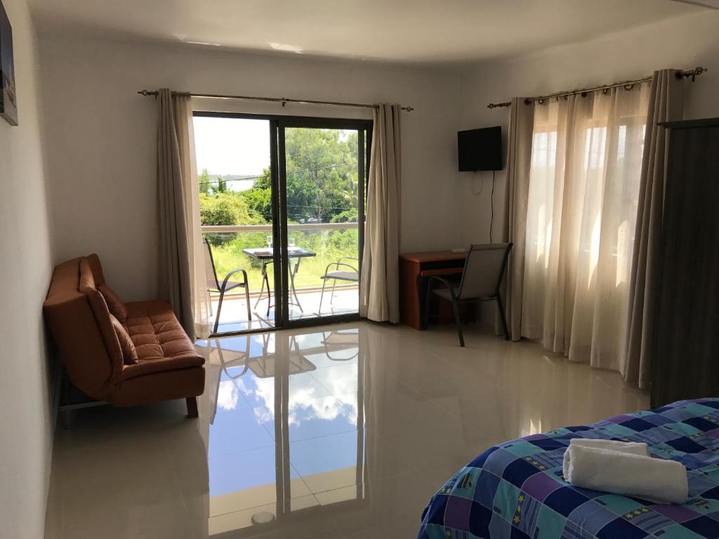 Postel nebo postele na pokoji v ubytování Luxe Exotica Apartments