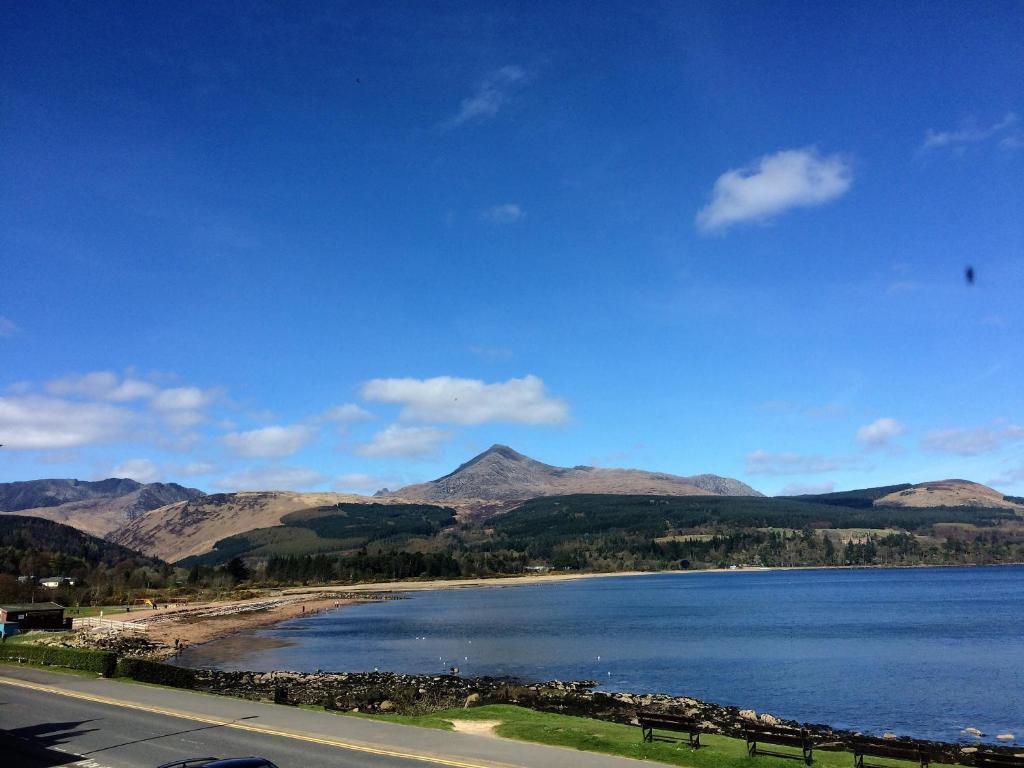 a view of a lake with mountains in the background at Hunters Guest House in Brodick
