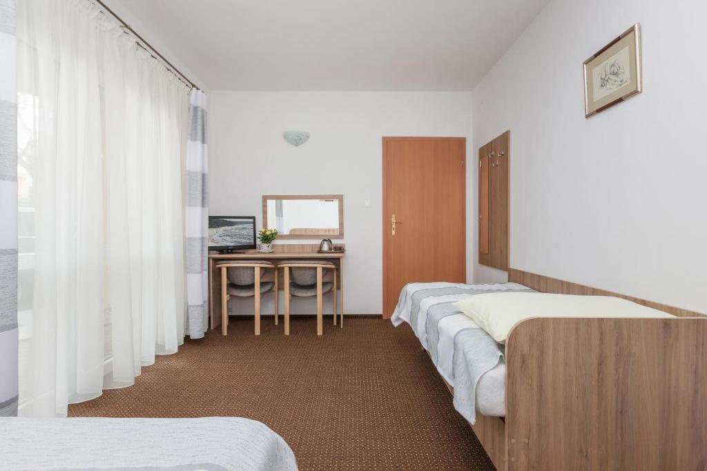 Postel nebo postele na pokoji v ubytování Dom Gościnny Oskar