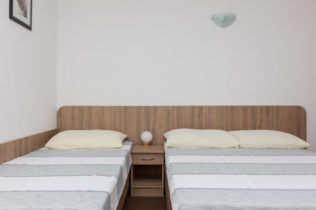 Postel nebo postele na pokoji v ubytování Dom Gościnny Oskar