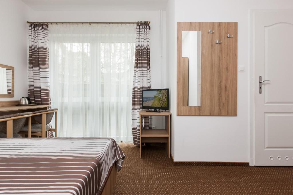 Postel nebo postele na pokoji v ubytování Dom Gościnny Oskar