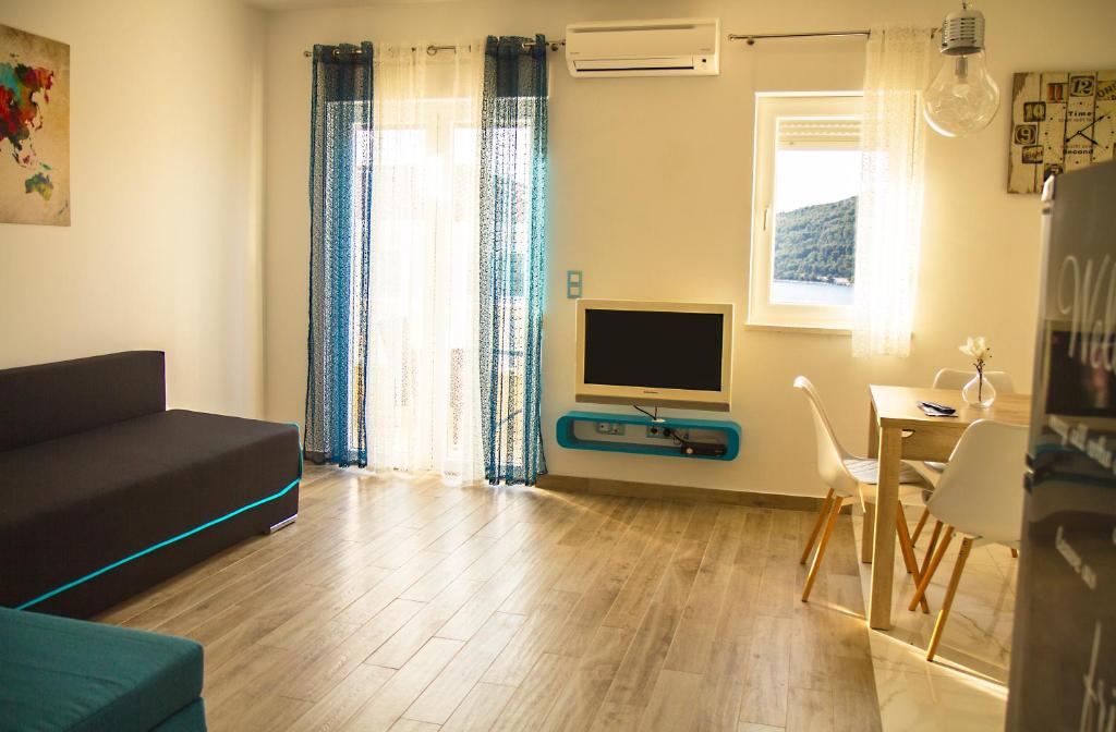 TV a/nebo společenská místnost v ubytování Apartment Punta