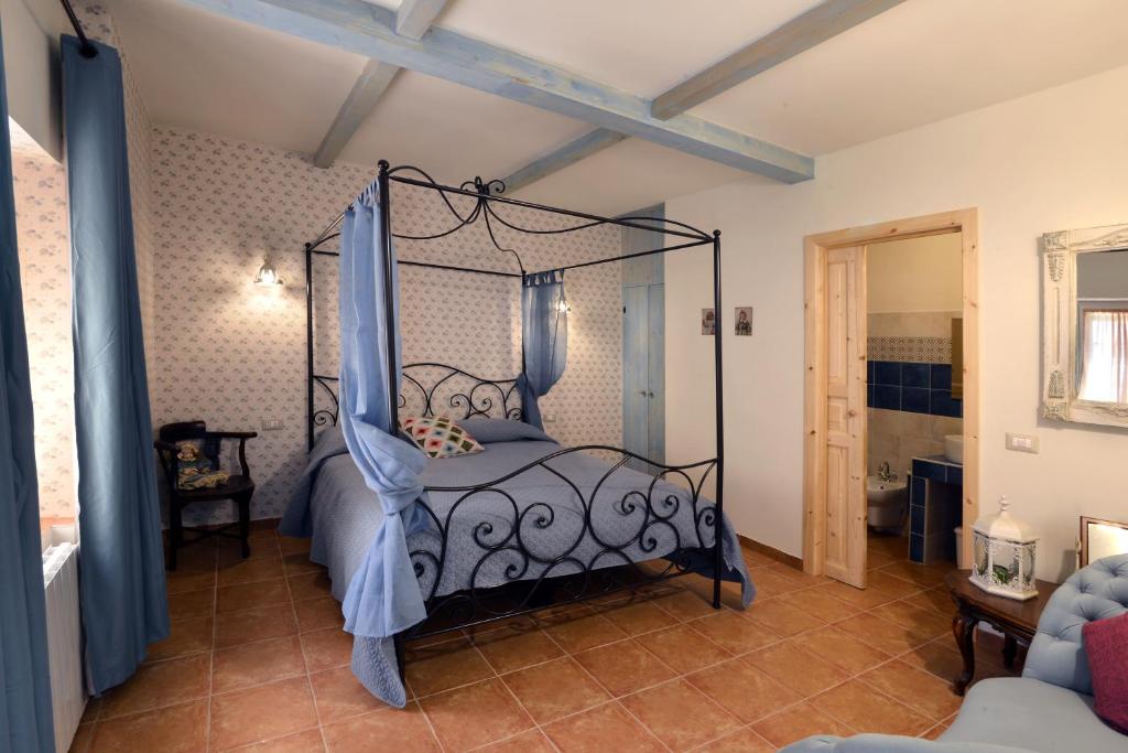 
a bedroom with a large bed and a large window at Borgo dei Pescatori Lecco in Lecco
