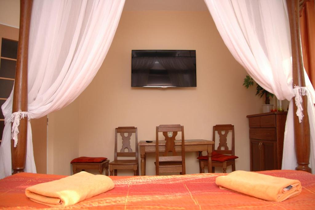 Postel nebo postele na pokoji v ubytování Penzion V Roklich & Apartmens V Roklich