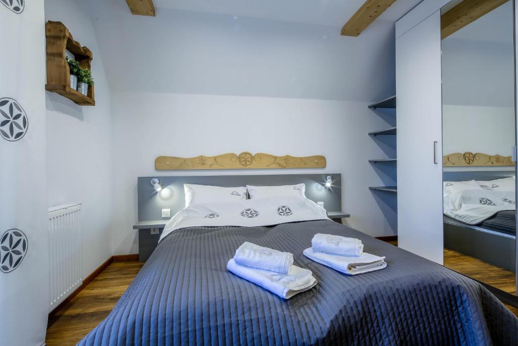 Posteľ alebo postele v izbe v ubytovaní Apartament Tatrzanski Raj