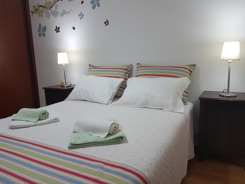 Postel nebo postele na pokoji v ubytování Villa Oliveira Apartments