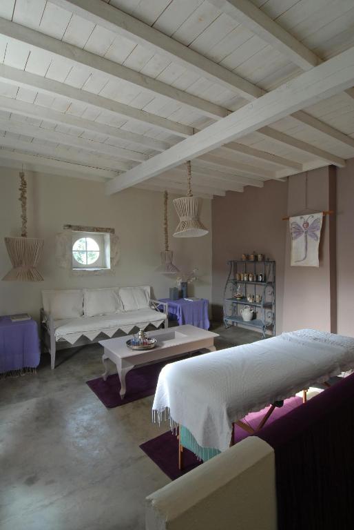 Postel nebo postele na pokoji v ubytování HOTEL et APPARTEMENTS DOMAINE DES CLOS - Teritoria