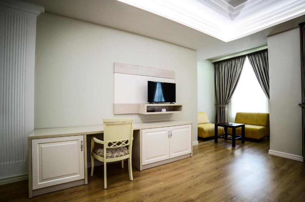 TV a/nebo společenská místnost v ubytování Hotel Vila Imperial