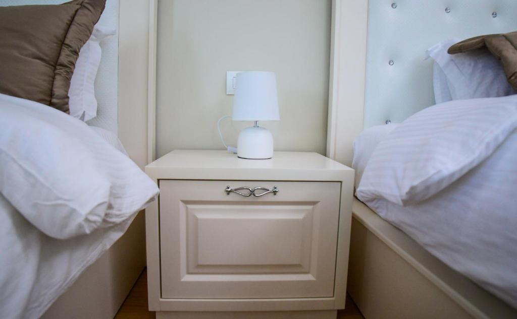 Postel nebo postele na pokoji v ubytování Hotel Vila Imperial