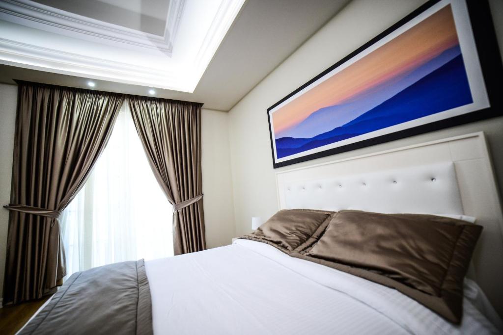Postel nebo postele na pokoji v ubytování Hotel Vila Imperial