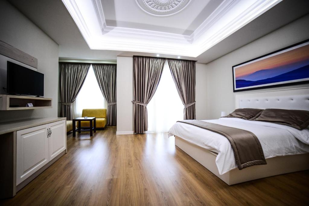 Postel nebo postele na pokoji v ubytování Hotel Vila Imperial