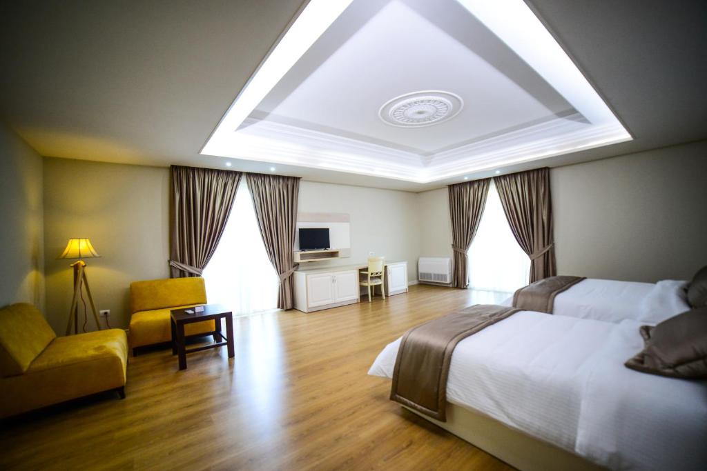 Postel nebo postele na pokoji v ubytování Hotel Vila Imperial