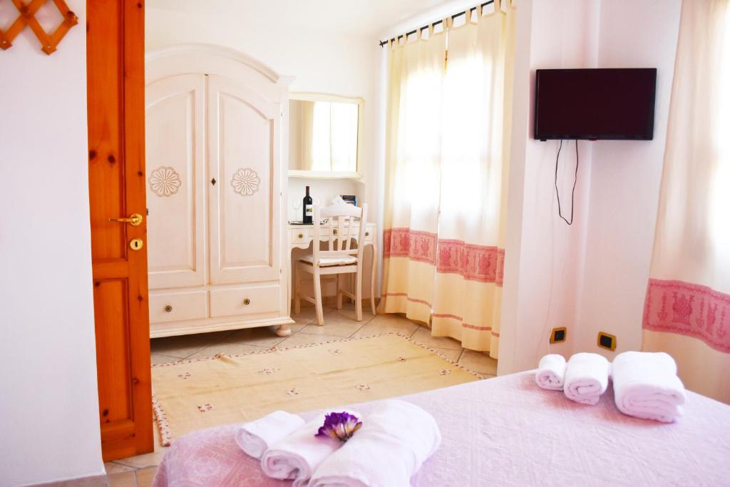 Postel nebo postele na pokoji v ubytování Casa Vacanza Porto Frailis già Porto Frailis B&B