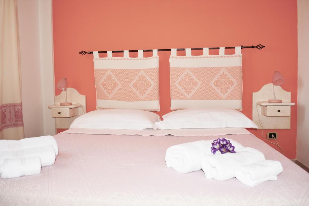 Postel nebo postele na pokoji v ubytování Casa Vacanza Porto Frailis già Porto Frailis B&B