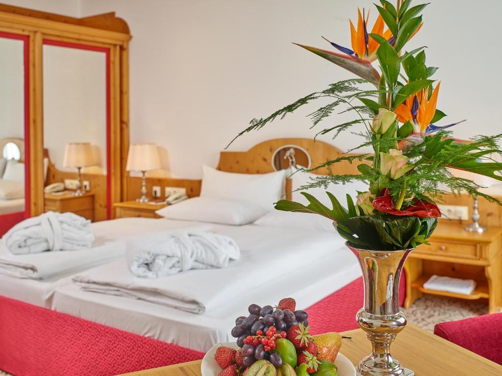 Postel nebo postele na pokoji v ubytování Hotel Maximilian