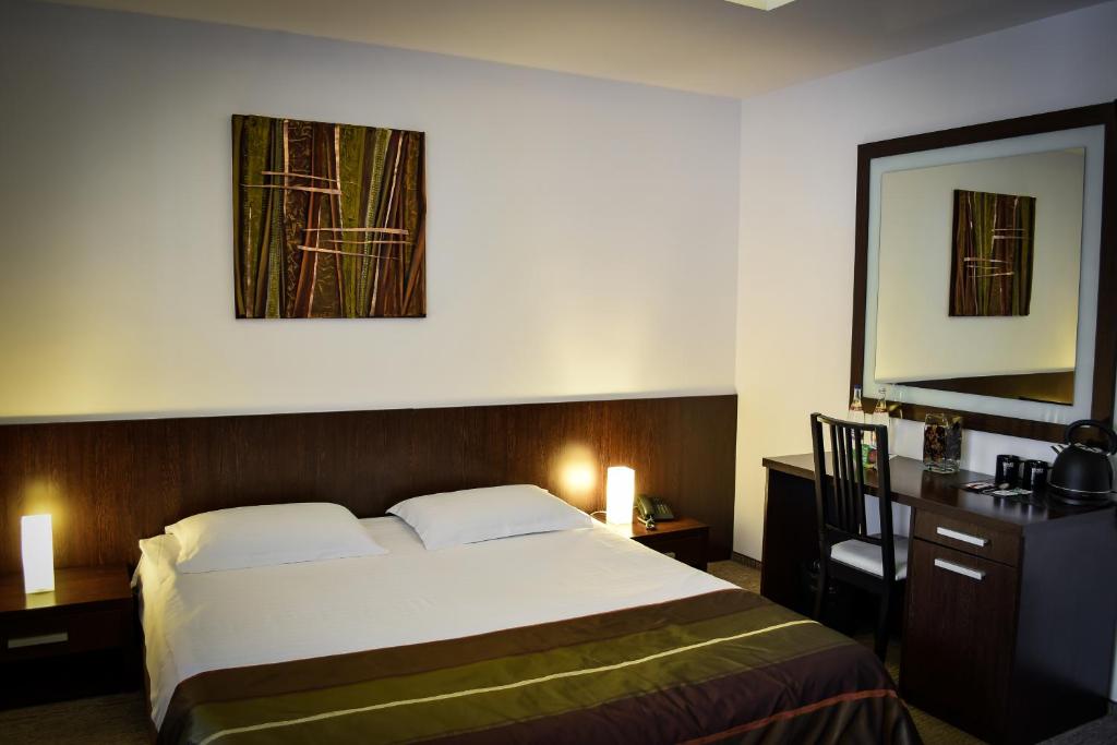 Postel nebo postele na pokoji v ubytování Hotel Smart