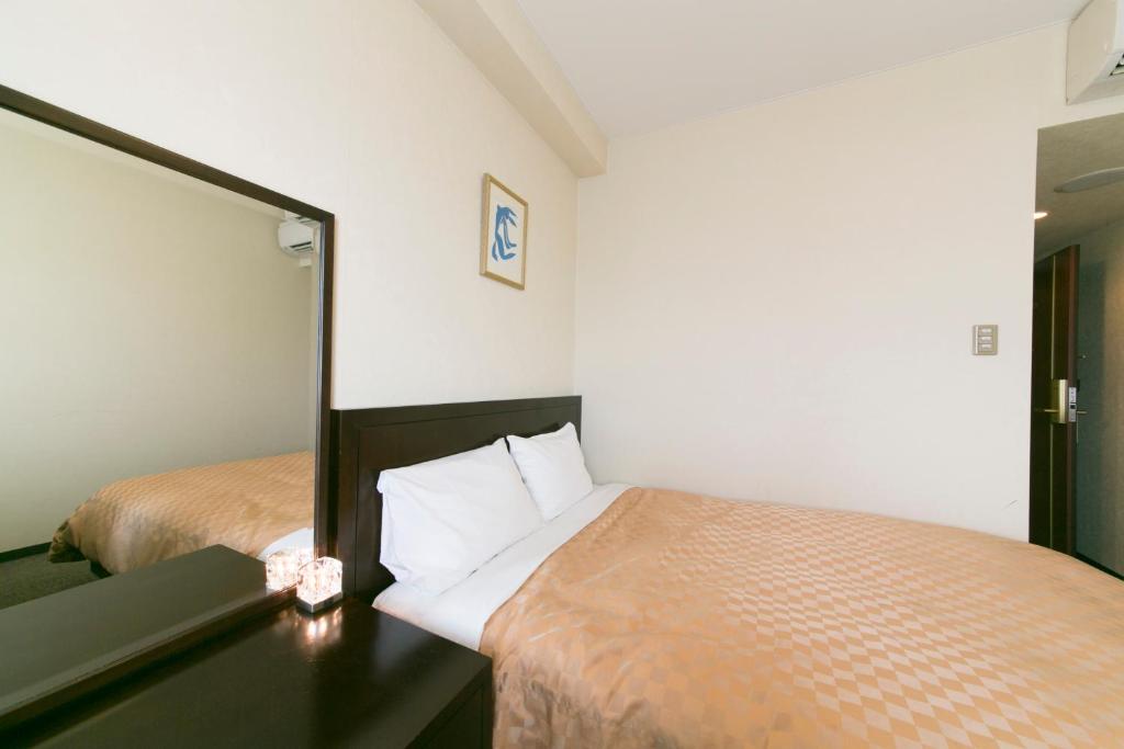 Postel nebo postele na pokoji v ubytování Hotel nanvan Yaizu