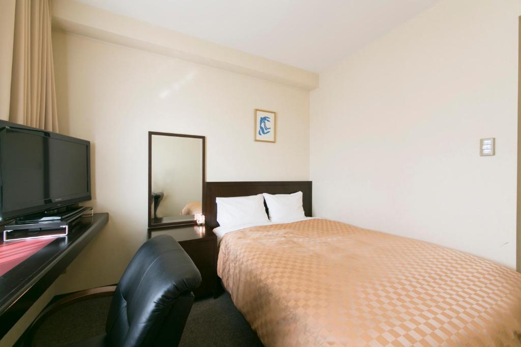 Postel nebo postele na pokoji v ubytování Hotel nanvan Yaizu
