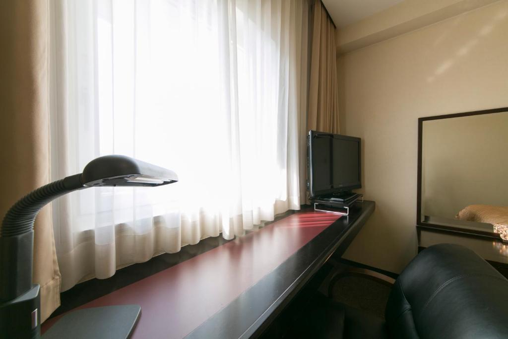TV a/nebo společenská místnost v ubytování Hotel nanvan Yaizu