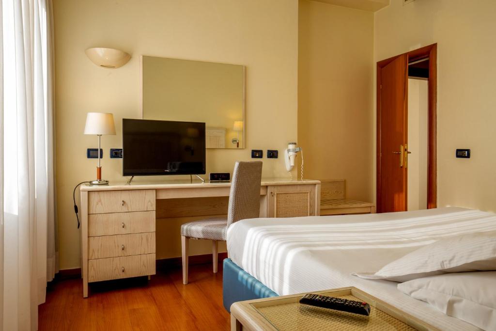 Postel nebo postele na pokoji v ubytování Best Western Hotel Globus