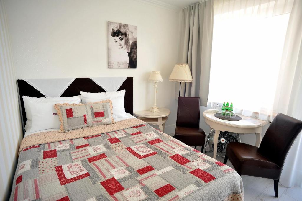Postel nebo postele na pokoji v ubytování Hotel Ottaviano