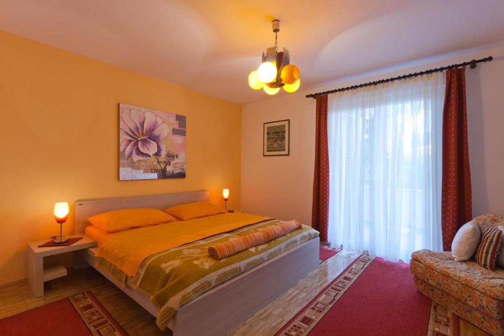 Postel nebo postele na pokoji v ubytování Apartments Neda