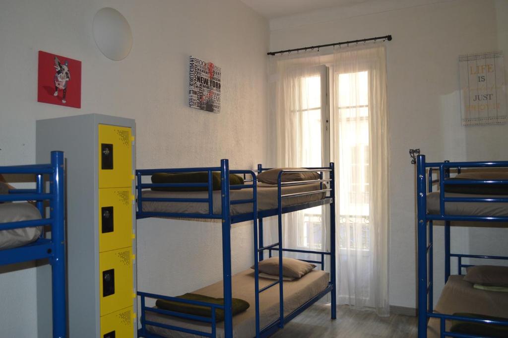 Postel nebo postele na pokoji v ubytování Backpackers Chez Patrick