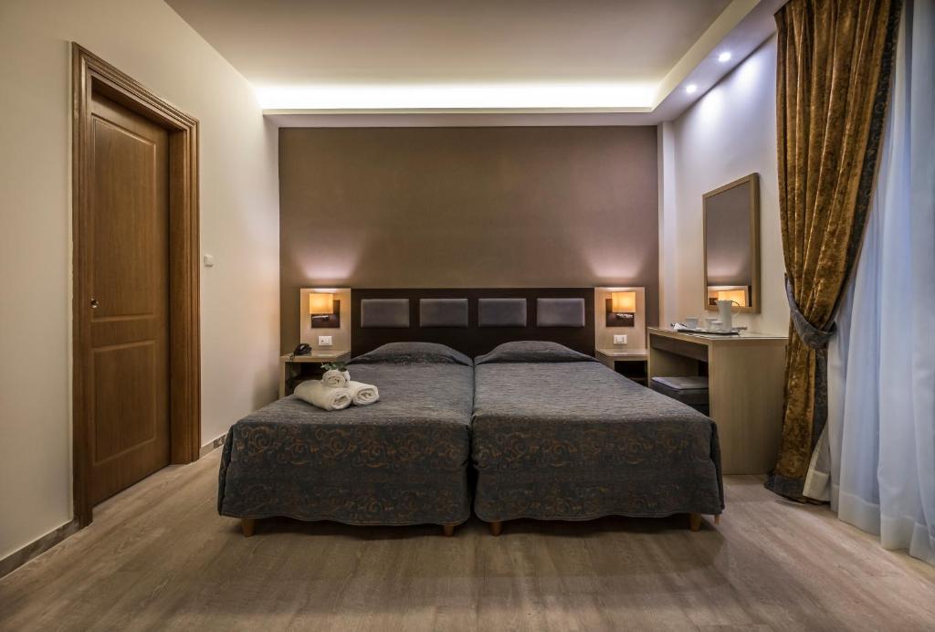 Postel nebo postele na pokoji v ubytování Rex Hotel