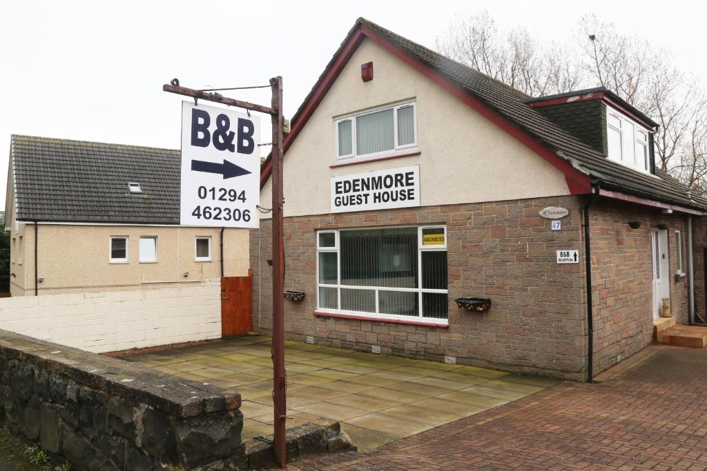 a building with a sign for a bathroom guest house at Edenmore in Ardrossan