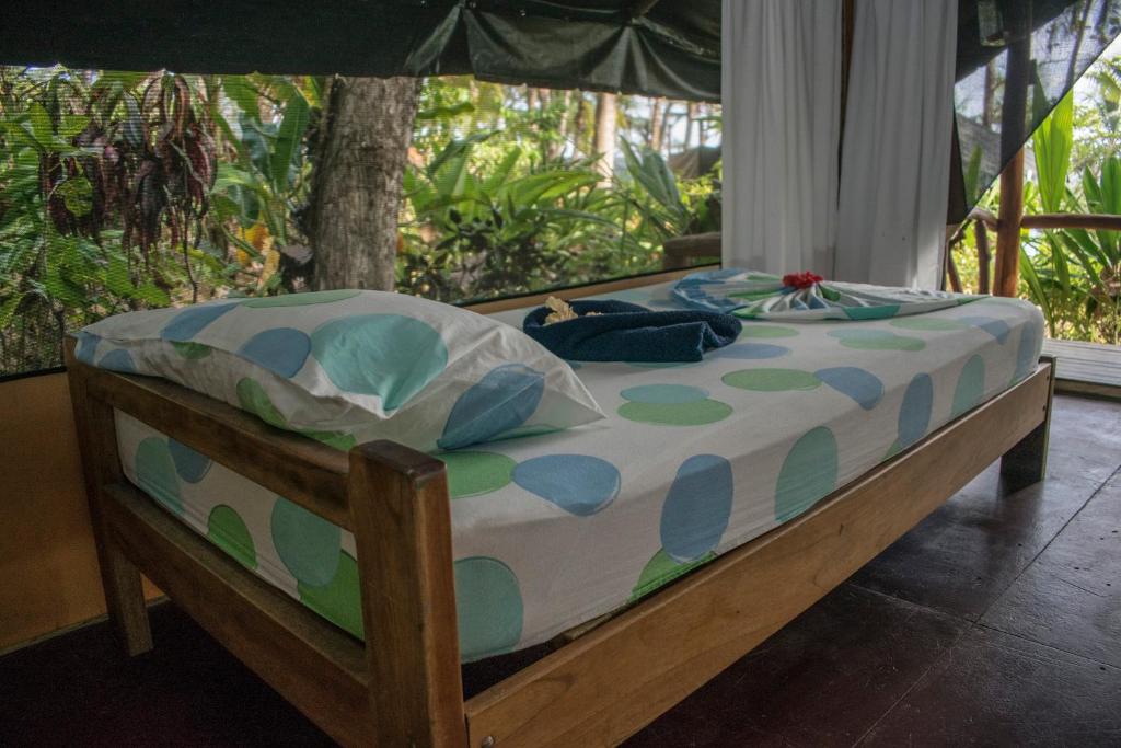 Postel nebo postele na pokoji v ubytování La Leona Eco Lodge