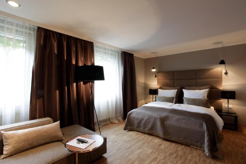 Postel nebo postele na pokoji v ubytování Hotel Gude