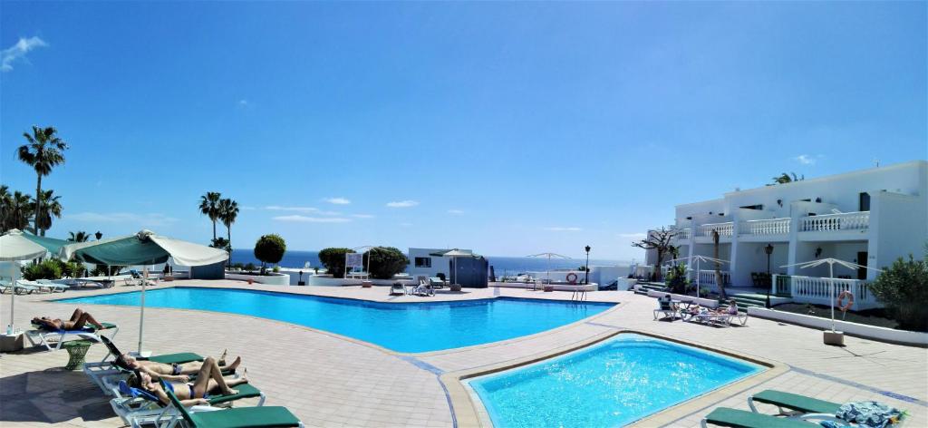 Swimmingpoolen hos eller tæt på Apartamento Renovado,vistas piscina, aire acondicionado,wifi