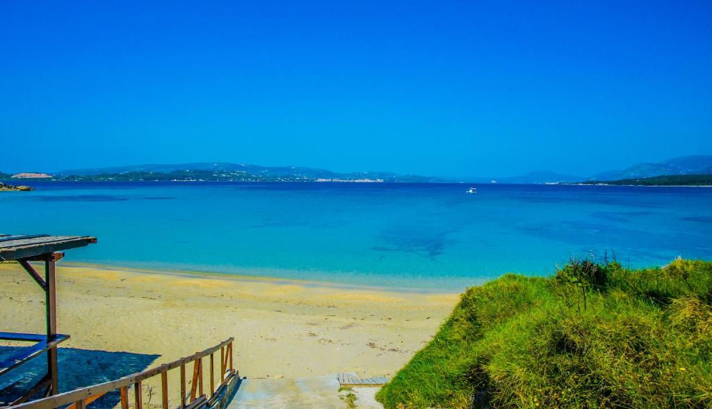 a beach with a view of the water at Aloni Studios and Apartments in Lassi
