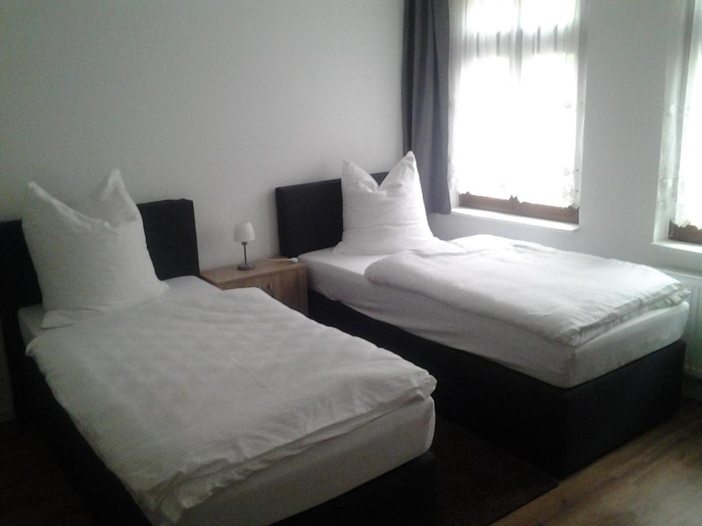 Postel nebo postele na pokoji v ubytování Gästezimmer in Lindenau