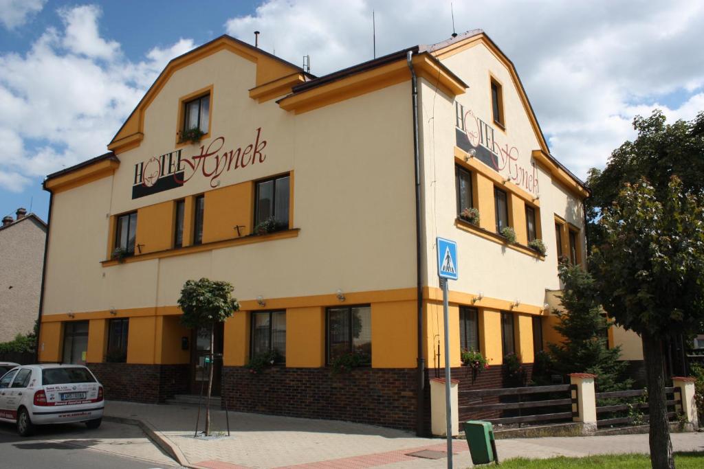 a building with a car parked in front of it at Hotel Hynek in Náchod