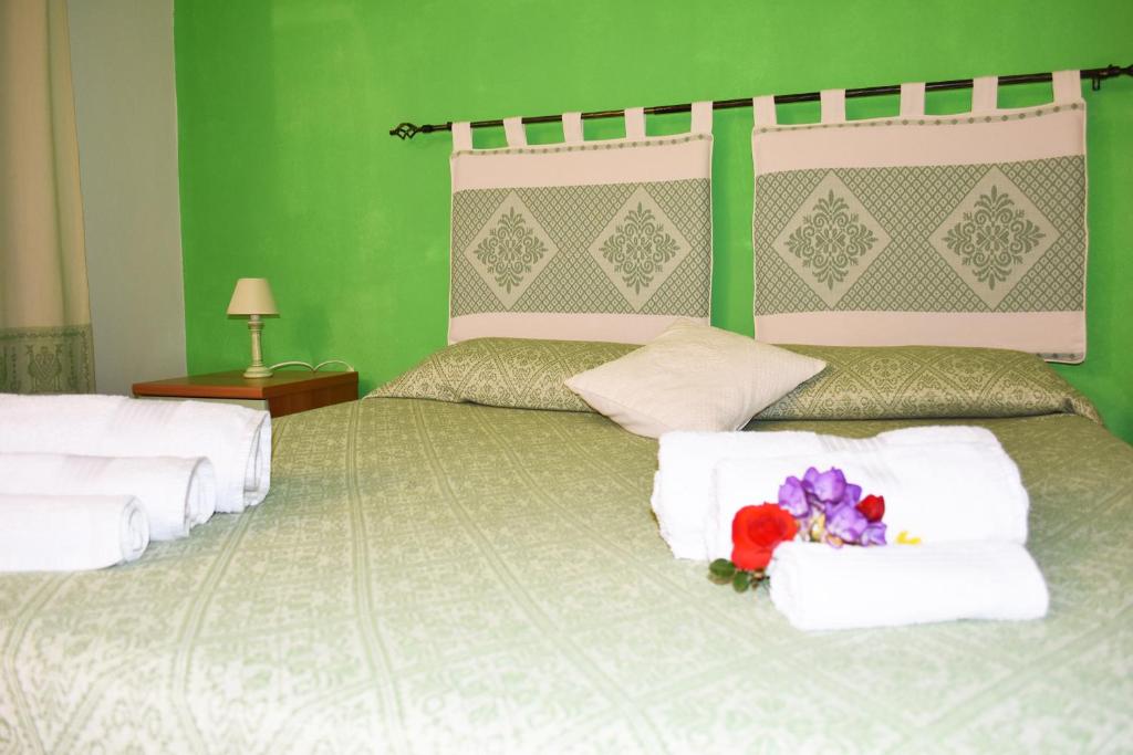 Postel nebo postele na pokoji v ubytování Casa Vacanza Porto Frailis già Porto Frailis B&B