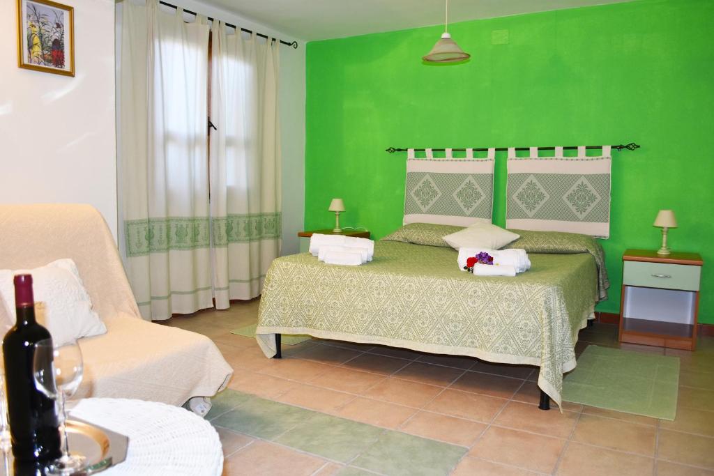 Postel nebo postele na pokoji v ubytování Casa Vacanza Porto Frailis già Porto Frailis B&B