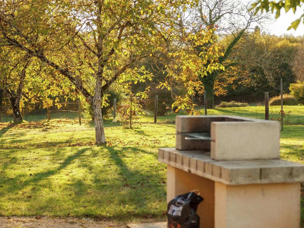 a toaster oven sitting on top of a field at Amazing Holiday Home in Cazals with Terrace in Cazals