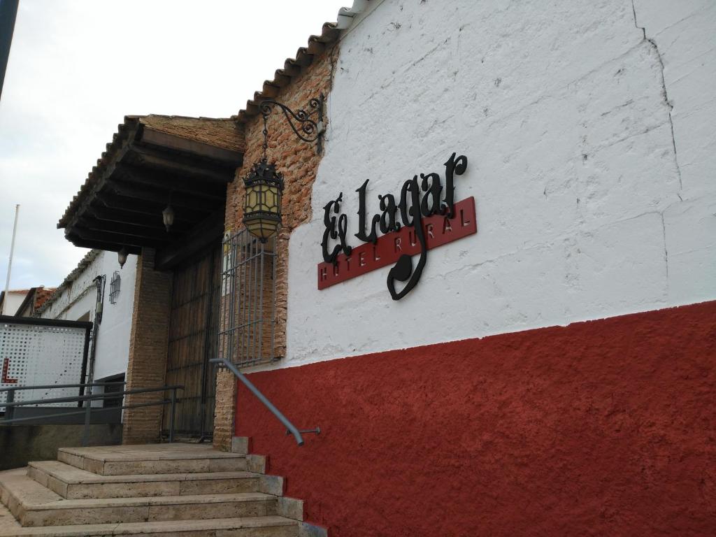 a building with a sign on the side of it at Hotel Rural El Lagar in La Solana